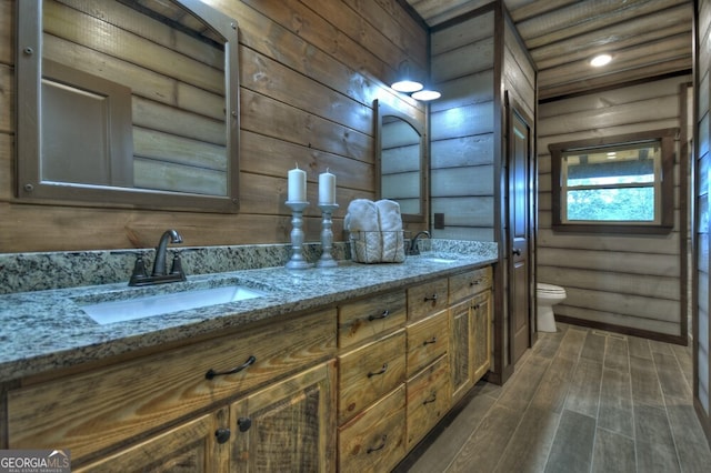 330 Serenity Ridge Ln, Mineral Bluff, GA 30559 - full bathroom with rustic walls, double vanity, and wood finished floors