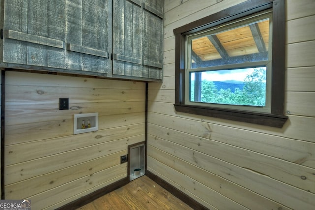 330 Serenity Ridge Ln, Mineral Bluff, GA 30559 - laundry area with hookup for a washing machine, wood walls, cabinet space, electric dryer hookup, and wood finished floors