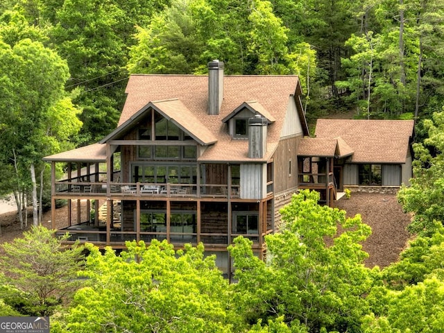 330 Serenity Ridge Ln, Mineral Bluff, GA 30559 - rear view of property with a deck, a chimney, a forest view, a shingled roof, and stairway