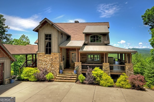 330 Serenity Ridge Ln, Mineral Bluff, GA 30559 - view of front of home featuring stone siding, covered porch, board and batten siding, a metal roof, and a standing seam roof