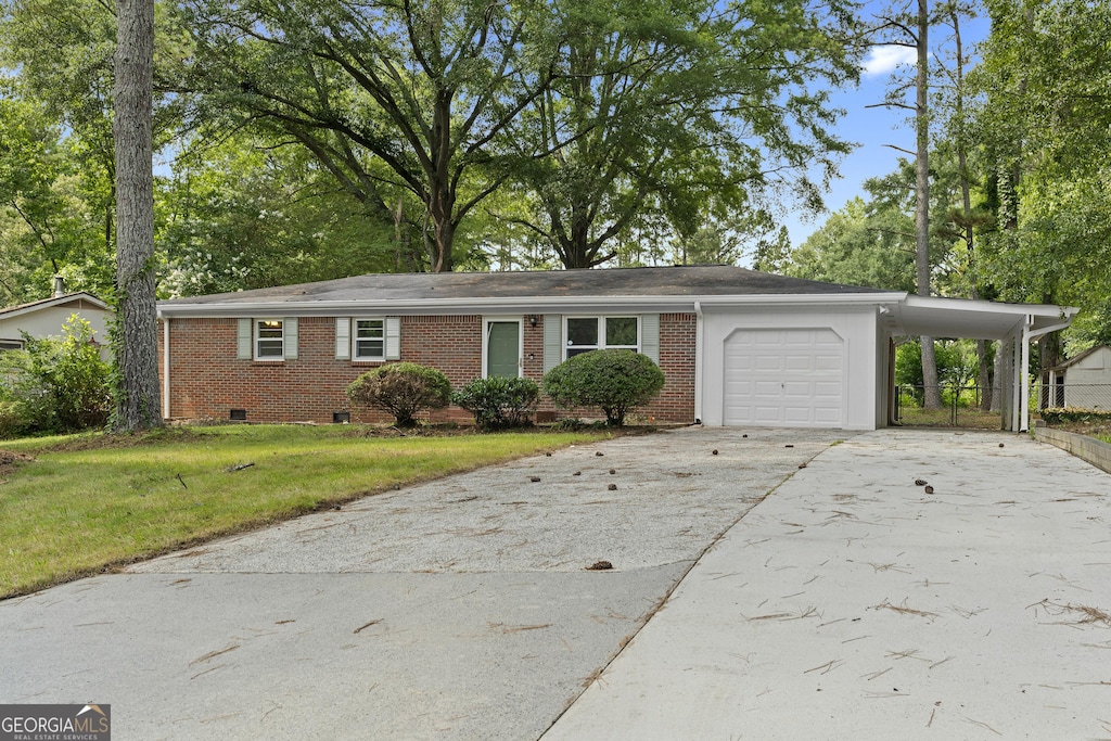 3152 Ridgecrest Dr, Powder Springs, GA 30127 - view of front of property featuring brick siding, crawl space, a front lawn, driveway, and a garage