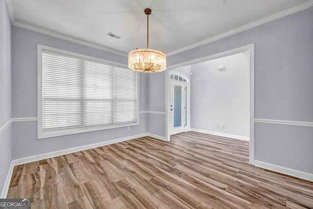 269 Legends Trce, Mcdonough, GA 30253 - unfurnished dining area featuring a chandelier, wood finished floors, and crown molding