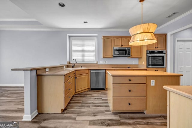 269 Legends Trce, Mcdonough, GA 30253 - kitchen featuring stainless steel appliances, ornamental molding, light wood-type flooring, a center island, and light countertops