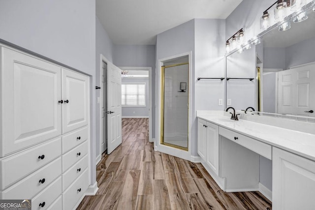 269 Legends Trce, Mcdonough, GA 30253 - bathroom with a shower stall, vanity, and wood finished floors