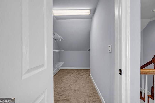 269 Legends Trce, Mcdonough, GA 30253 - spacious closet featuring vaulted ceiling and carpet floors