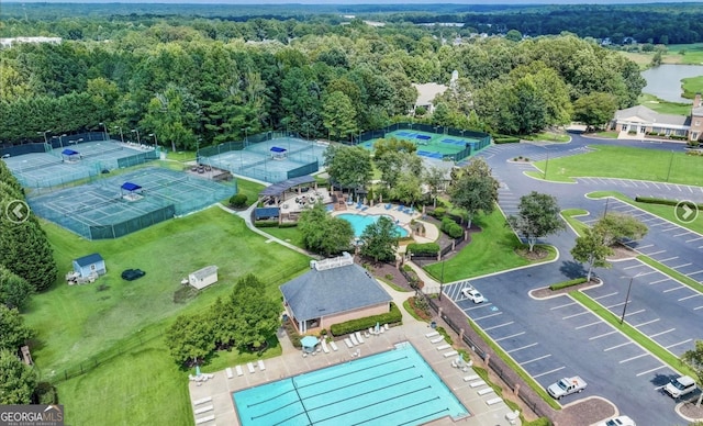 269 Legends Trce, Mcdonough, GA 30253 - drone / aerial view of a pool area and a heavily wooded area