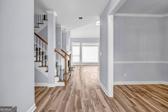 269 Legends Trce, Mcdonough, GA 30253 - entryway with ornamental molding, wood finished floors, stairway, and lofted ceiling