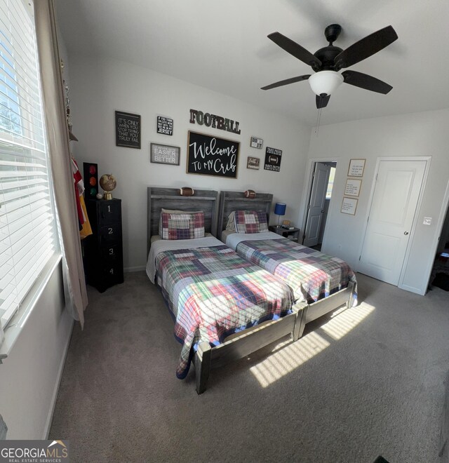 5257 Shorthorn Way, Powder Springs, GA 30127 - carpeted bedroom with multiple windows and ceiling fan