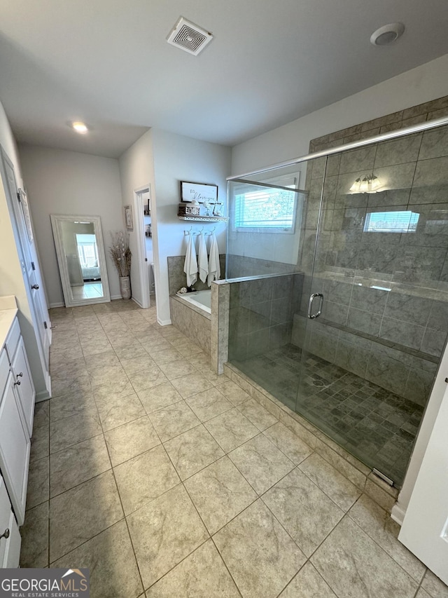5257 Shorthorn Way, Powder Springs, GA 30127 - full bathroom featuring vanity, a shower stall, a garden tub, and tile patterned floors
