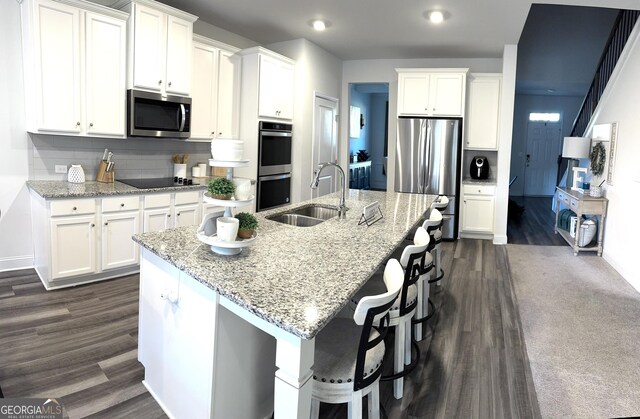 5257 Shorthorn Way, Powder Springs, GA 30127 - kitchen featuring appliances with stainless steel finishes, white cabinets, and recessed lighting