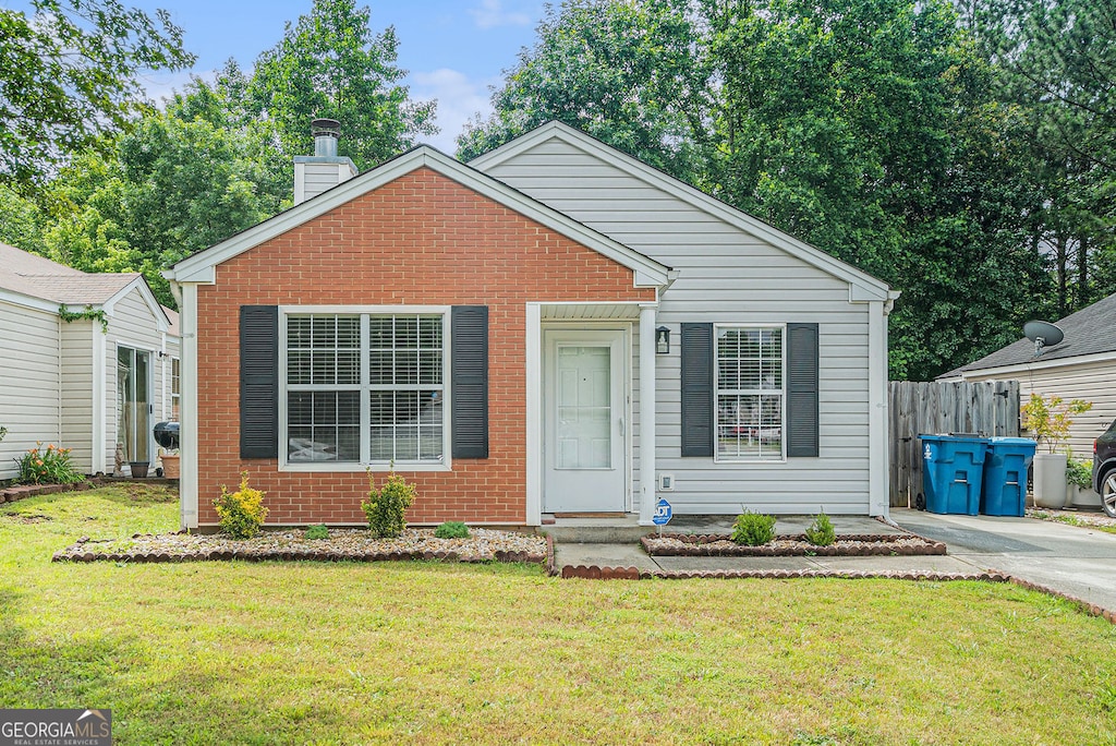 2026 Patterson Park Pl, Lawrenceville, GA 30044 - view of front facade with brick siding and a chimney