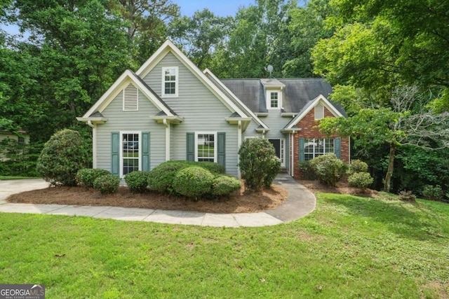 46 Highland Ct, Carrollton, GA 30116 - traditional-style house with a front yard and brick siding