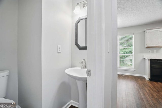 46 Highland Ct, Carrollton, GA 30116 - bathroom featuring wood finished floors and a textured ceiling