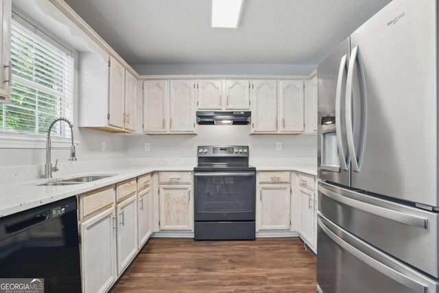 46 Highland Ct, Carrollton, GA 30116 - kitchen featuring appliances with stainless steel finishes, under cabinet range hood, dark wood-type flooring, and light stone counters