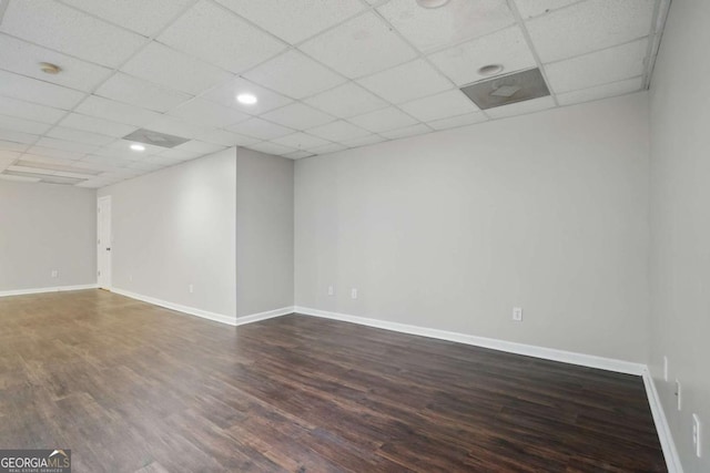 46 Highland Ct, Carrollton, GA 30116 - unfurnished room featuring dark wood-type flooring, a paneled ceiling, and a smoke detector
