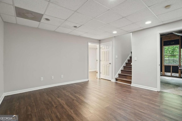 46 Highland Ct, Carrollton, GA 30116 - spare room featuring stairway, a drop ceiling, wood finished floors, recessed lighting, and a smoke detector