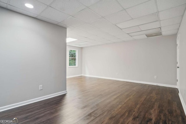 46 Highland Ct, Carrollton, GA 30116 - empty room with dark wood-type flooring and a drop ceiling