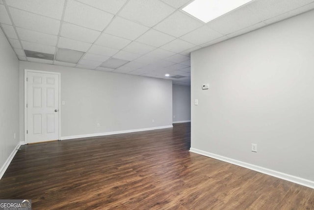 46 Highland Ct, Carrollton, GA 30116 - spare room with dark wood-style floors and a paneled ceiling