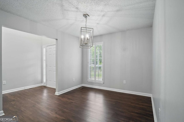 46 Highland Ct, Carrollton, GA 30116 - unfurnished dining area featuring a chandelier, wood finished floors, and a textured ceiling