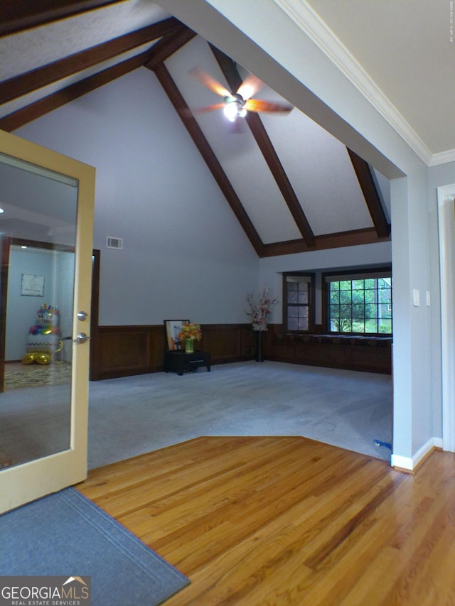 5741 Wolf Laurel Ln SW, Lilburn, GA 30047 - unfurnished living room featuring carpet flooring, beam ceiling, ceiling fan, and high vaulted ceiling