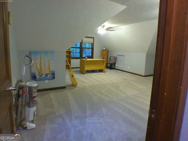 5741 Wolf Laurel Ln SW, Lilburn, GA 30047 - bonus room with carpet, lofted ceiling, and a textured ceiling