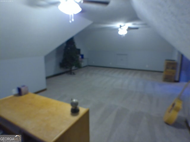 5741 Wolf Laurel Ln SW, Lilburn, GA 30047 - additional living space with vaulted ceiling, carpet flooring, and a ceiling fan