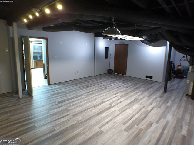 5741 Wolf Laurel Ln SW, Lilburn, GA 30047 - below grade area featuring light wood finished floors and electric panel