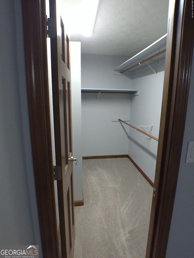 5741 Wolf Laurel Ln SW, Lilburn, GA 30047 - walk in closet with carpet flooring