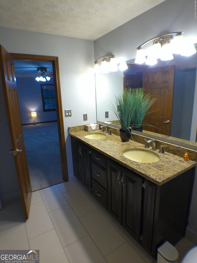 5741 Wolf Laurel Ln SW, Lilburn, GA 30047 - bathroom with double vanity and a textured ceiling