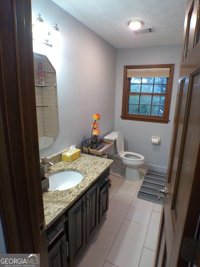 5741 Wolf Laurel Ln SW, Lilburn, GA 30047 - bathroom with vanity, a textured ceiling, and tile patterned floors