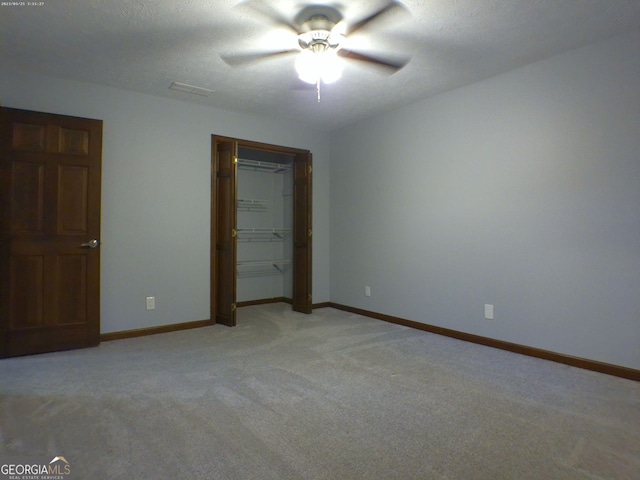 5741 Wolf Laurel Ln SW, Lilburn, GA 30047 - unfurnished bedroom featuring light carpet, a closet, and ceiling fan