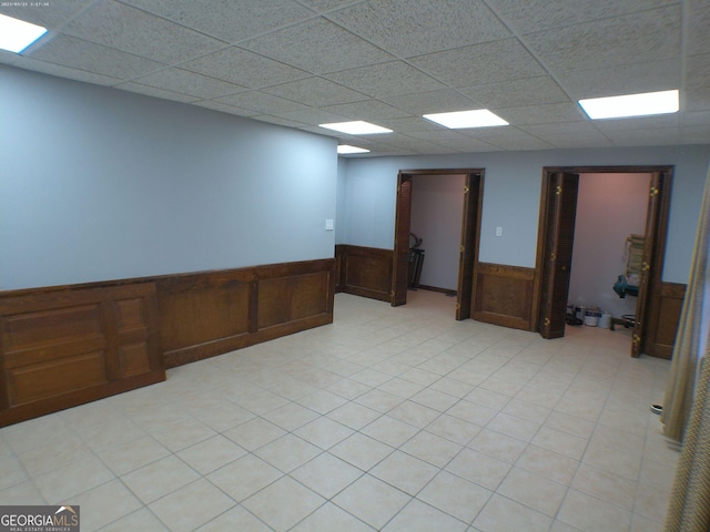 5741 Wolf Laurel Ln SW, Lilburn, GA 30047 - spare room with a wainscoted wall and a drop ceiling