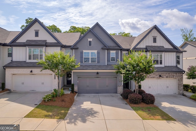 5615 Parkview Ln, Flowery Branch, GA 30542 - craftsman house with a garage, board and batten siding, and concrete driveway