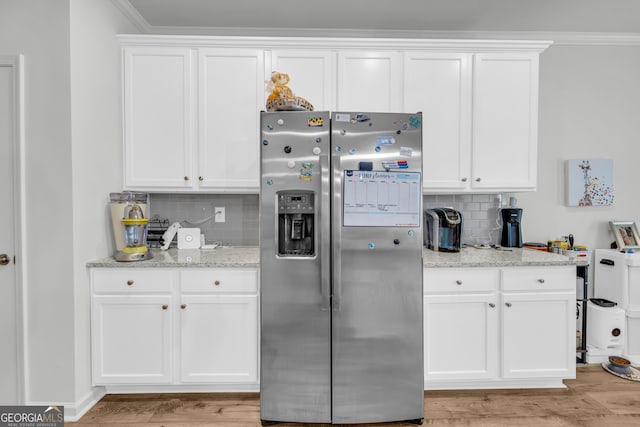 5615 Parkview Ln, Flowery Branch, GA 30542 - kitchen featuring stainless steel refrigerator with ice dispenser, backsplash, white cabinetry, light wood-type flooring, and light stone counters