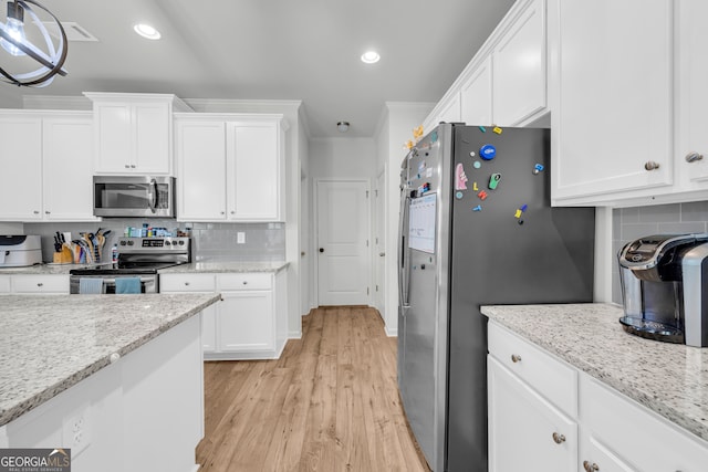 5615 Parkview Ln, Flowery Branch, GA 30542 - kitchen featuring appliances with stainless steel finishes, white cabinetry, backsplash, and recessed lighting