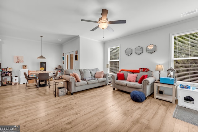 5615 Parkview Ln, Flowery Branch, GA 30542 - living area with wood finished floors, a ceiling fan, and ornamental molding