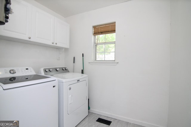 711 Main St, Byron, GA 31008 - laundry area featuring cabinet space and washing machine and dryer
