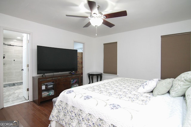 711 Main St, Byron, GA 31008 - bedroom with dark wood-style floors, a ceiling fan, and connected bathroom