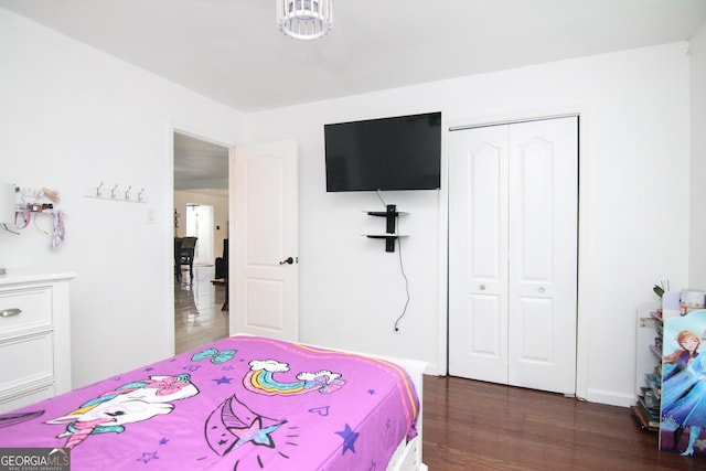 711 Main St, Byron, GA 31008 - bedroom featuring dark wood finished floors and a closet