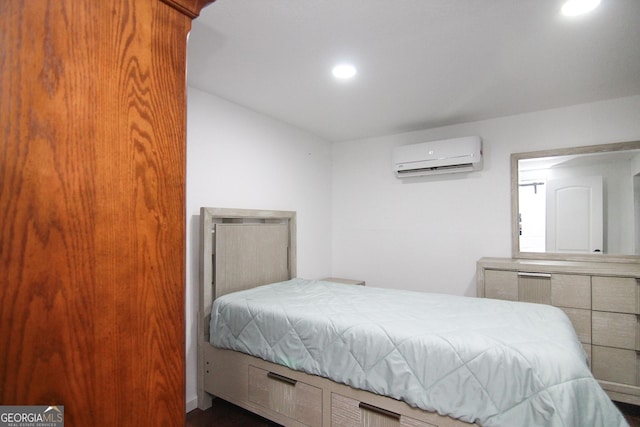 711 Main St, Byron, GA 31008 - bedroom featuring a wall mounted air conditioner and recessed lighting