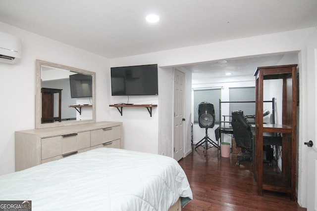 711 Main St, Byron, GA 31008 - bedroom featuring dark wood finished floors, a wall mounted AC, recessed lighting, and an office area