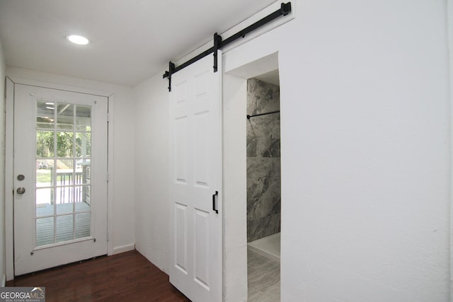 711 Main St, Byron, GA 31008 - doorway to outside with a barn door, dark wood finished floors, and recessed lighting