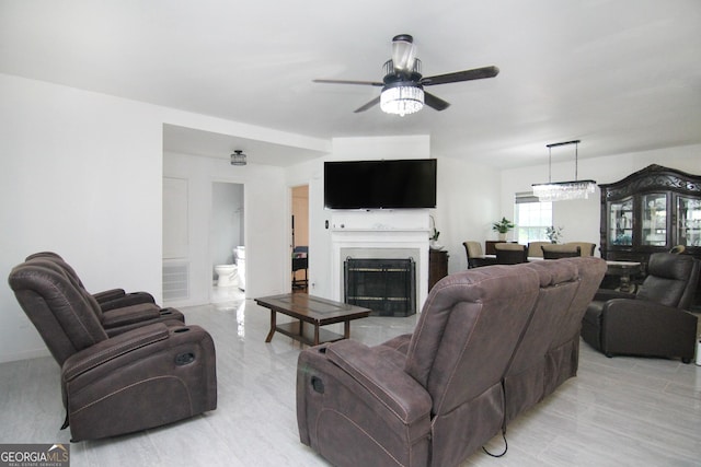 711 Main St, Byron, GA 31008 - living area featuring a ceiling fan and a fireplace