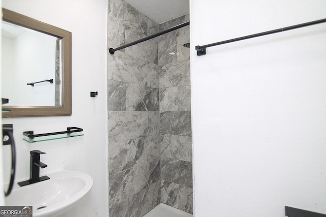 711 Main St, Byron, GA 31008 - full bathroom featuring a sink and a tile shower