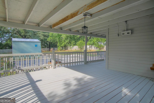 711 Main St, Byron, GA 31008 - deck featuring a storage unit and a fenced backyard