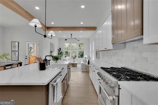 830 Gaston St SW, Atlanta, GA 30310 - kitchen featuring stainless steel appliances, recessed lighting, backsplash, white cabinets, and light wood-type flooring