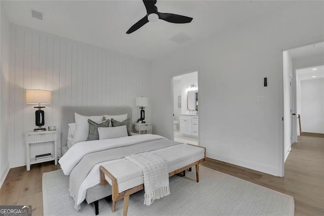 830 Gaston St SW, Atlanta, GA 30310 - bedroom with light wood finished floors, ensuite bath, and ceiling fan
