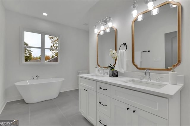 830 Gaston St SW, Atlanta, GA 30310 - bathroom with double vanity, a freestanding bath, and tile patterned floors