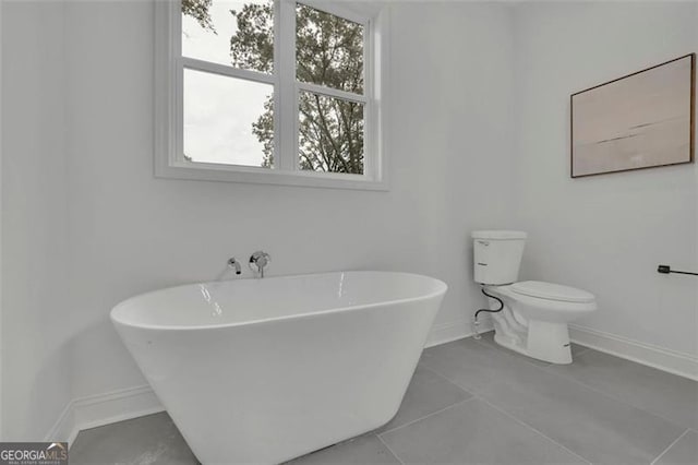 830 Gaston St SW, Atlanta, GA 30310 - full bath with a freestanding bath, plenty of natural light, and tile patterned floors
