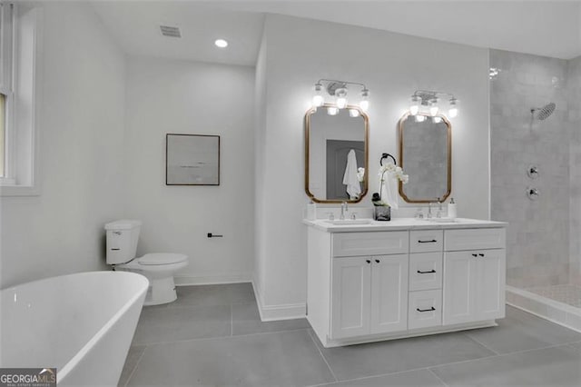 830 Gaston St SW, Atlanta, GA 30310 - bathroom featuring tile patterned floors, a soaking tub, double vanity, a tile shower, and recessed lighting